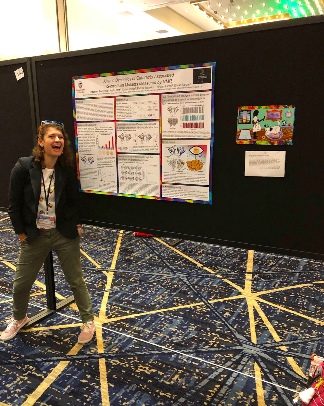 Photo of Heather standing in front of science poster.